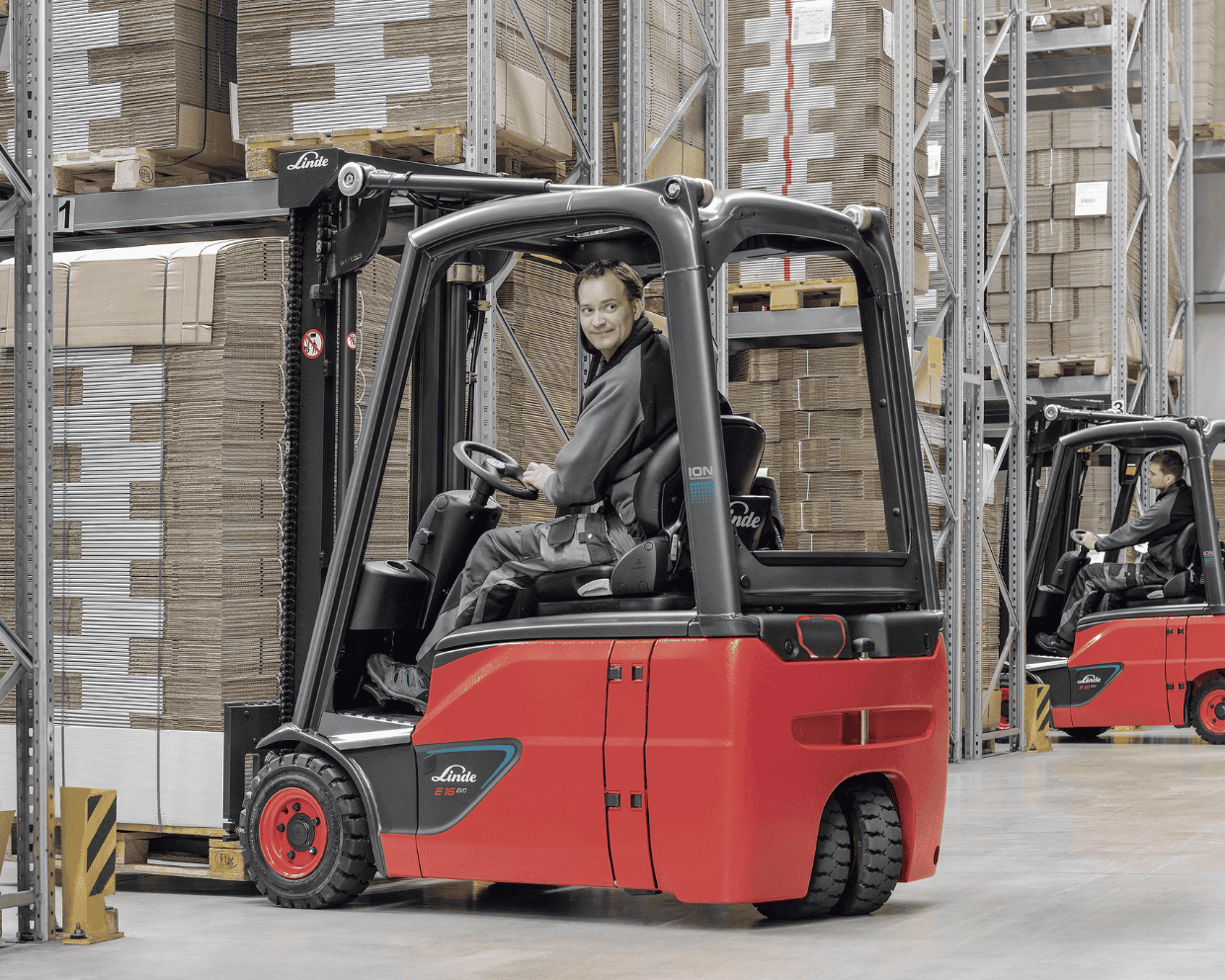 Linde electric 3-wheel forklift in warehouse