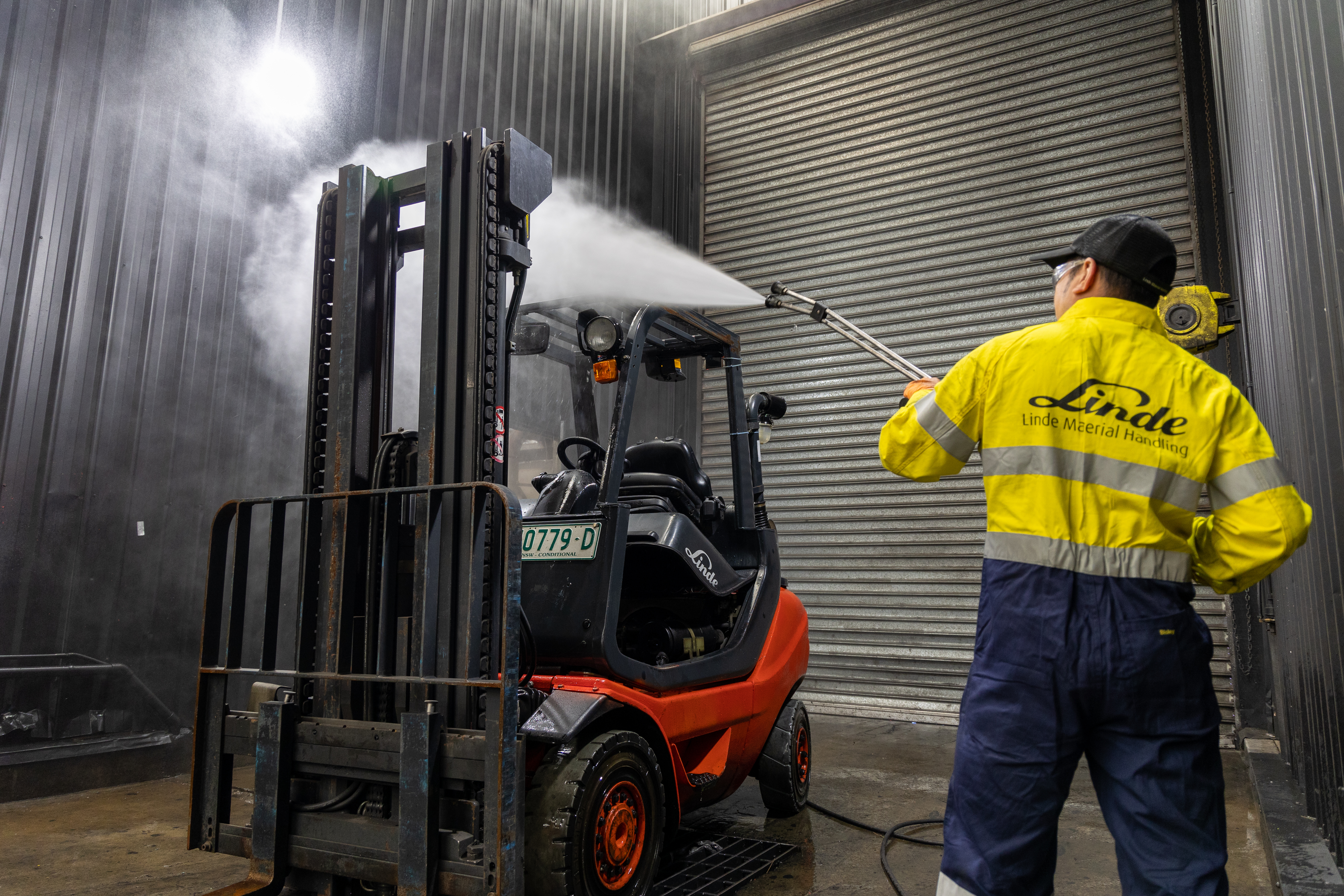 Red Linde used forklift undergoing reconditioning process