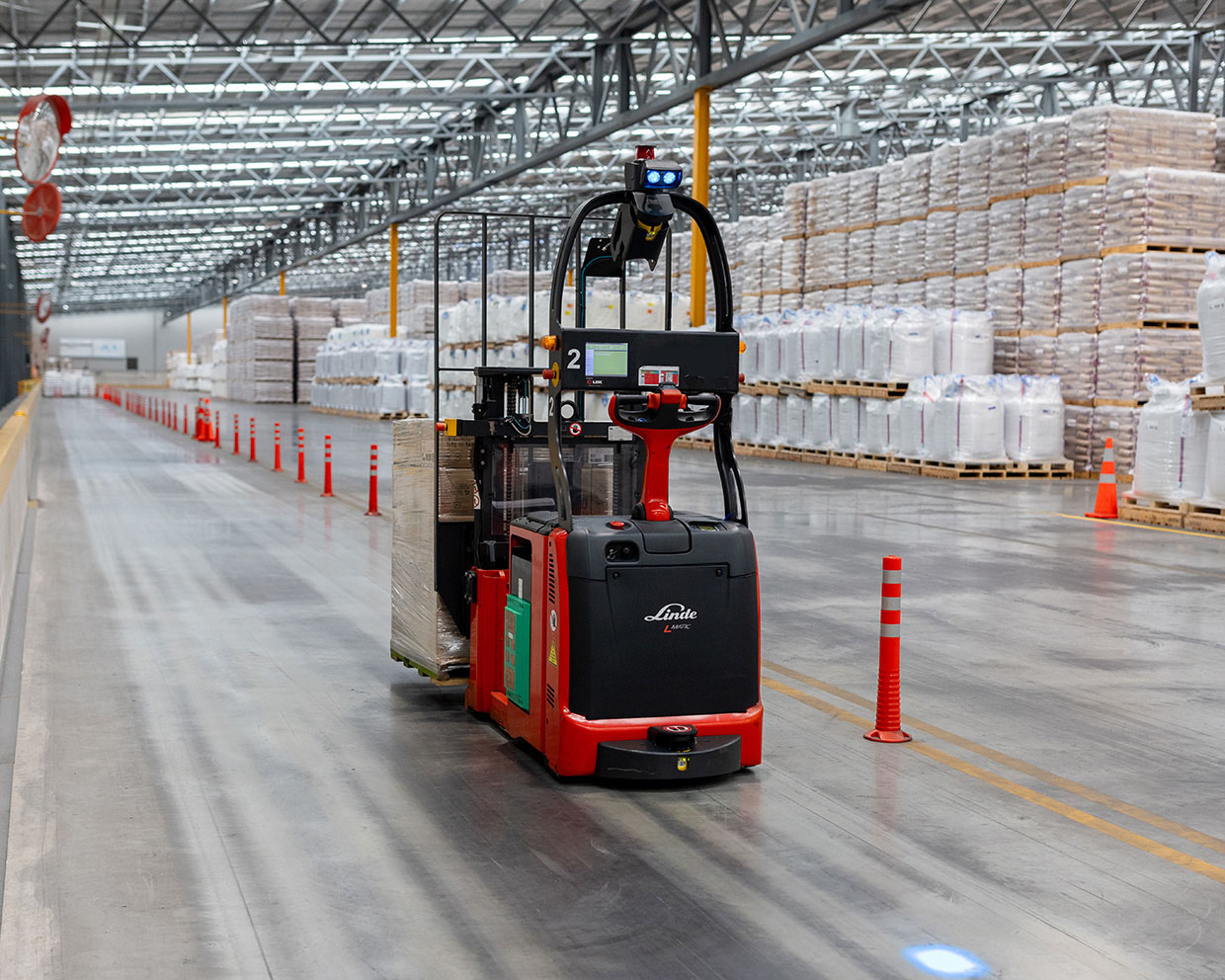 Automated Material Handling Linde automated truck carrying a load