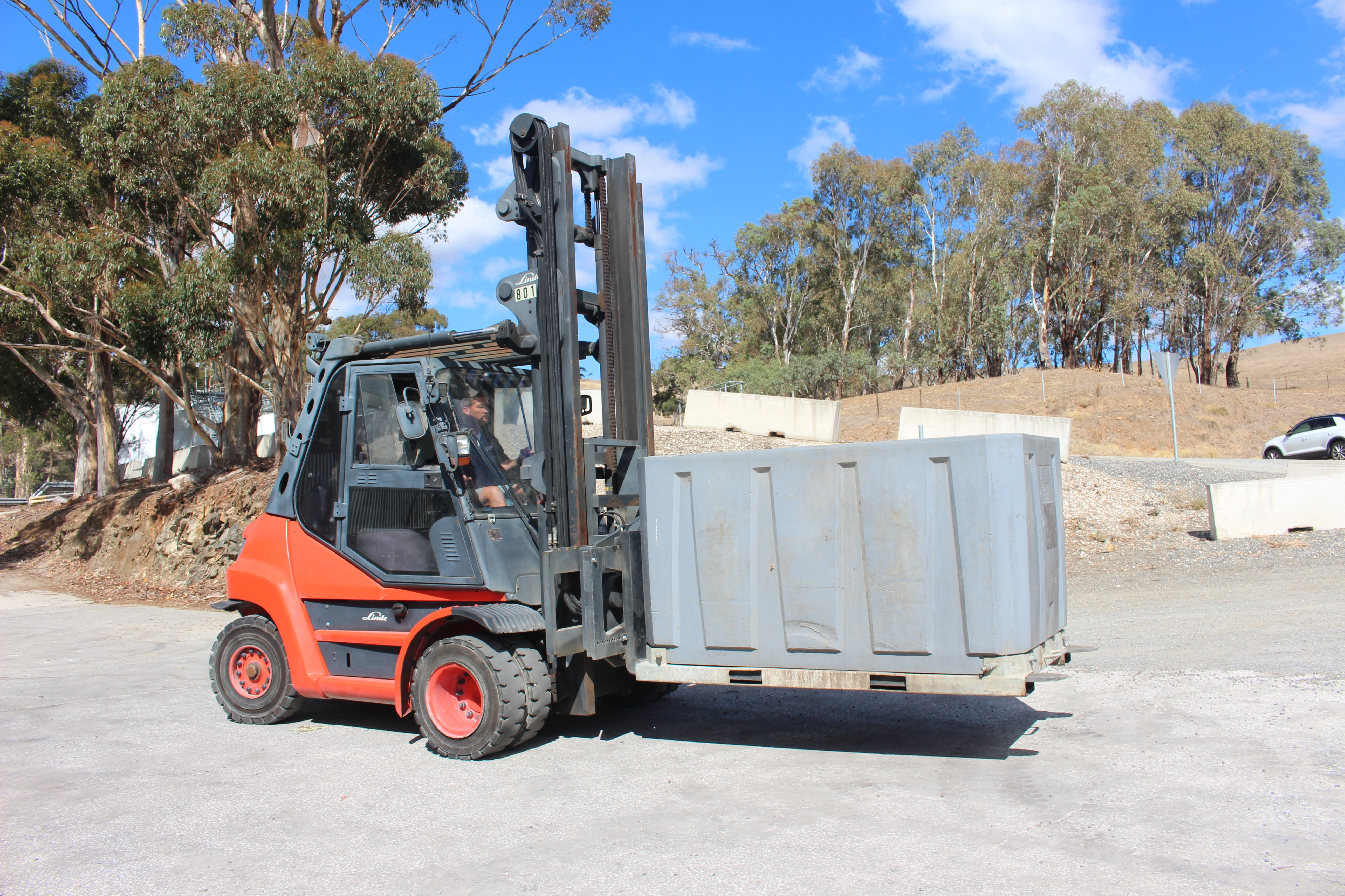 Red Linde heavy-duty 8 tonne forklift with customised attachment