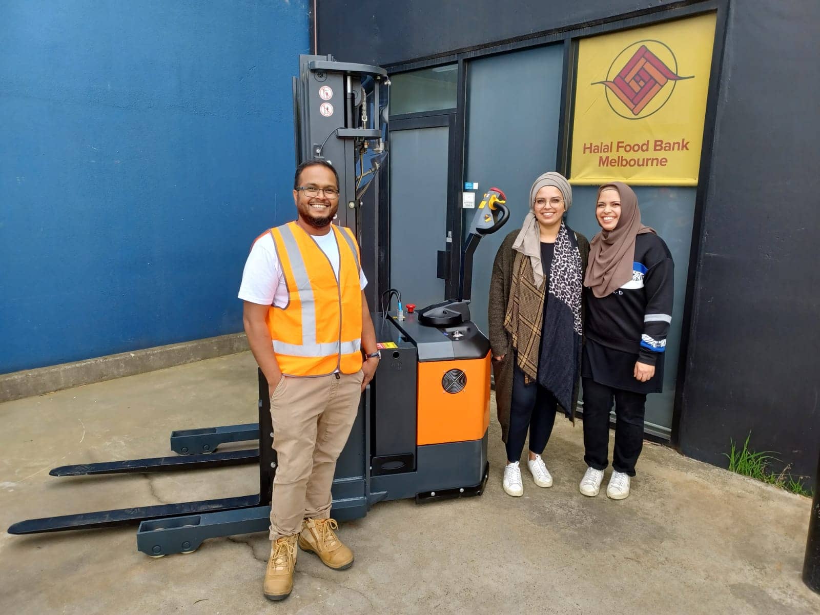 HFBM volunteers with their new Baoli stacker
