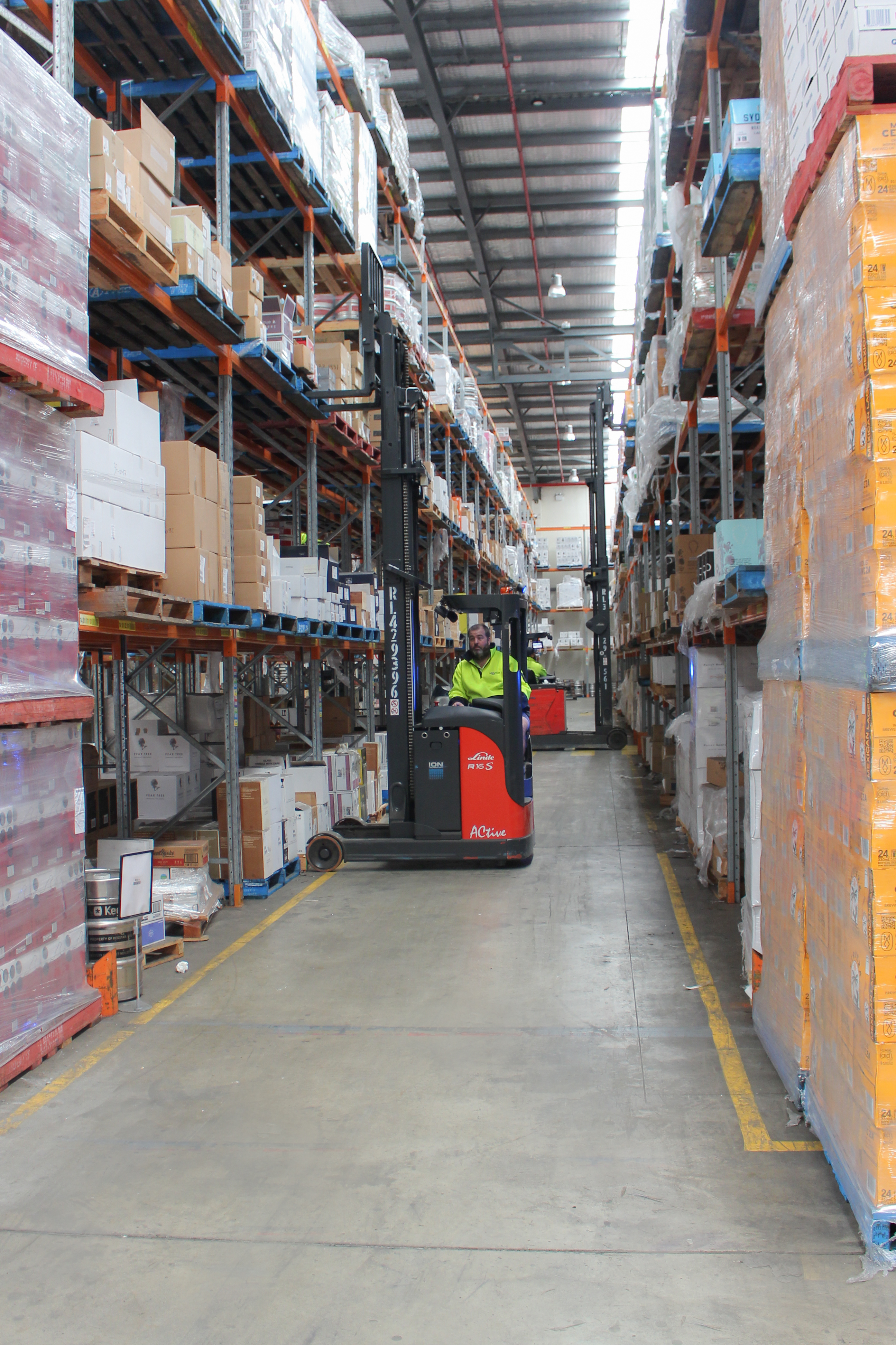 Electric reach trucks operating in high shelf applications at Motus Transport